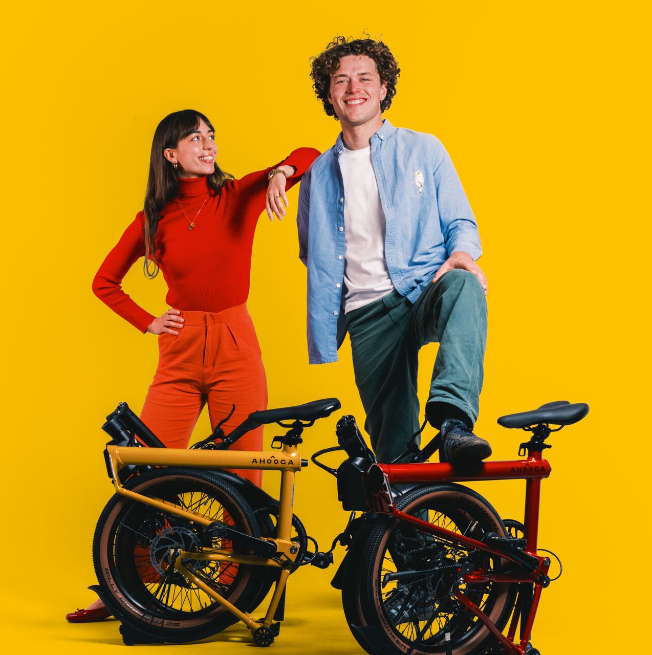 Two riders with a yellow and a red MAX on a yellow backdrop